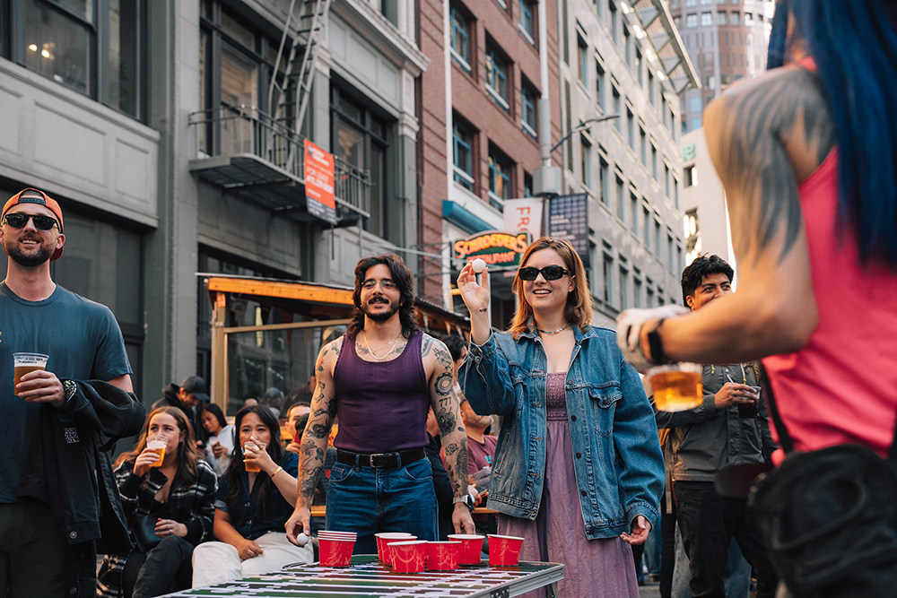 Crowd of people having fun and playing games in downtown San Francisco