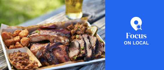 tray of smoked meats texas bbq style outside on picnic table on sunny summer day