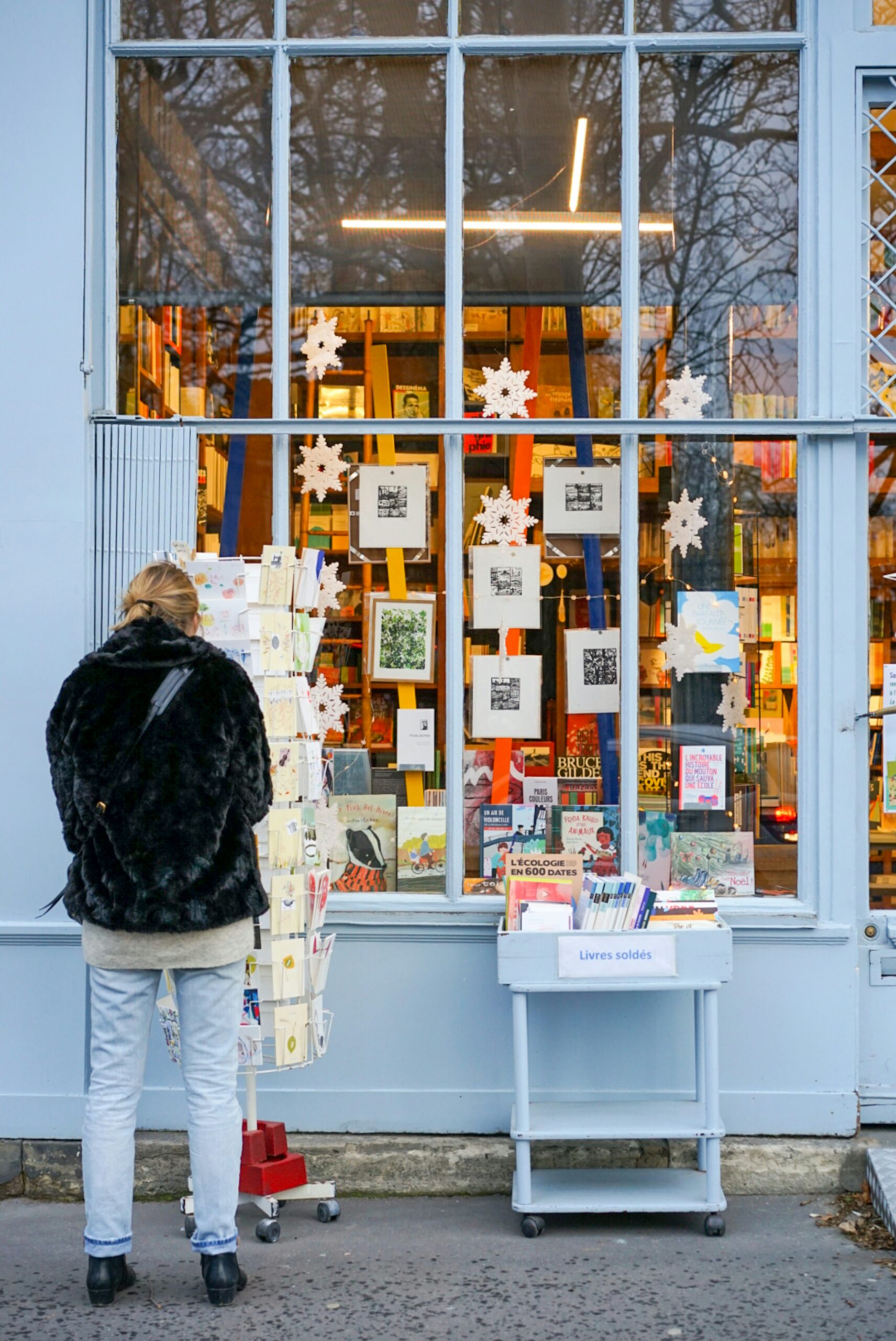 woman picking card at boutique