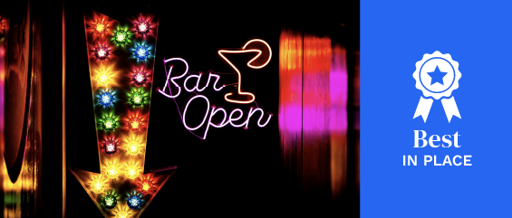 A neon bar open sign with a neon arrow A neon bar open sign with a neon arrow