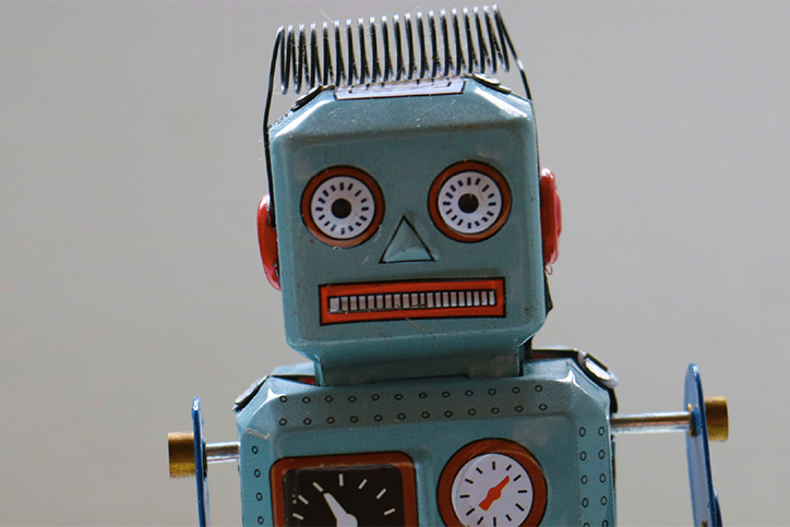 tin toy robot representing AI