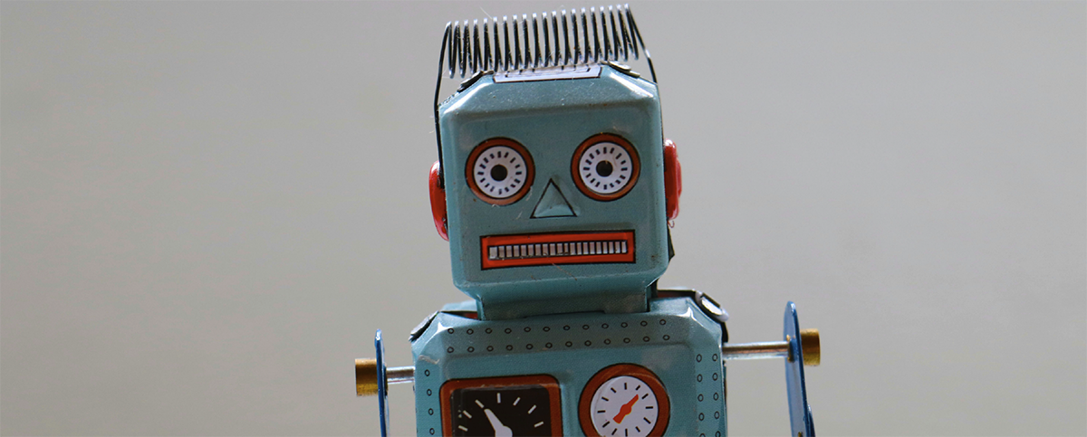 tin toy robot representing AI